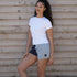Blue and charcoal Digby & Litten rugby shorts — full lifestyle view.