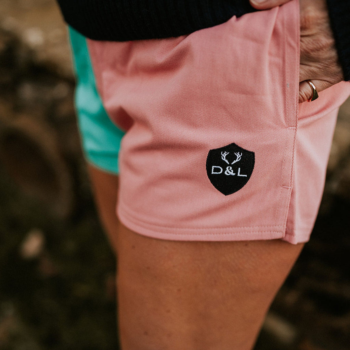 Digby &amp; Litten Coral &amp; Turquoise Rugby Shorts — close-up detail.